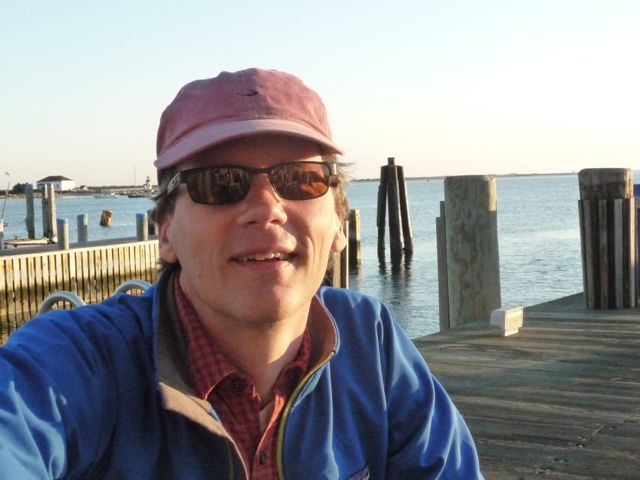 Photograph of Dr. Holden waiting
          for the Nantucket Ferry.