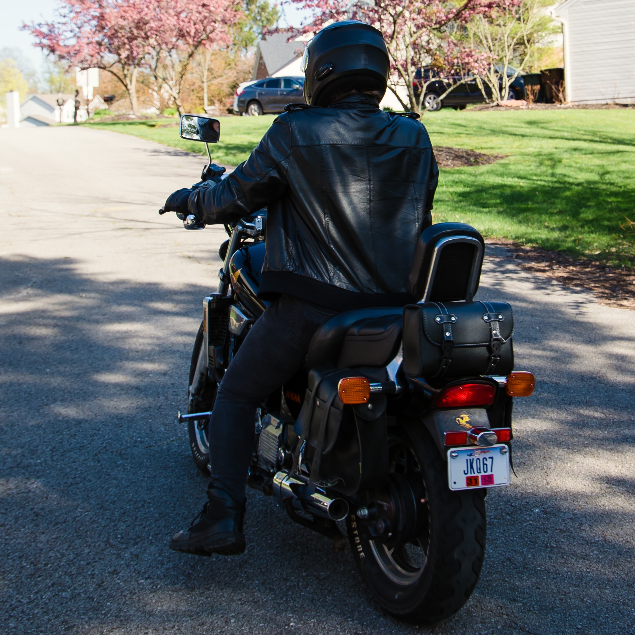 A picture of myself on my motorcycle in full gear facing away.