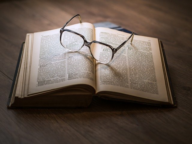 Image of a book and glasses