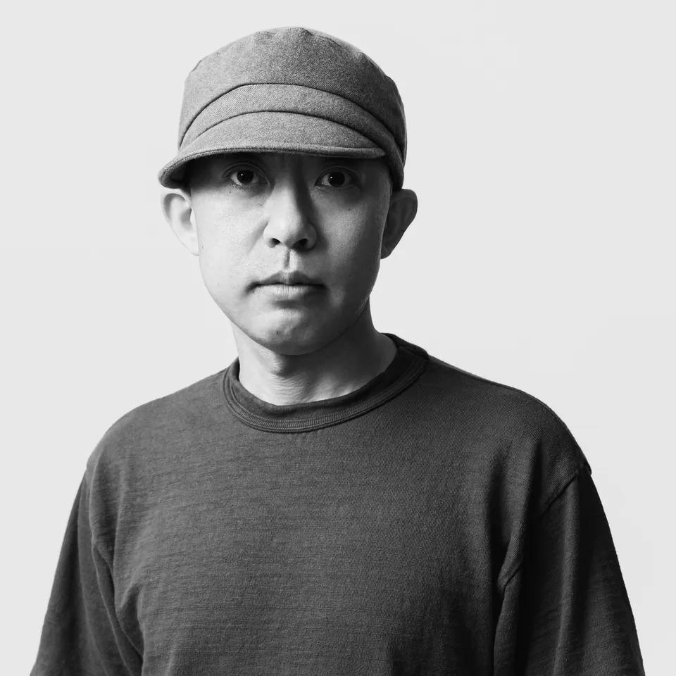 a bathing ape founder nigo in black and white photograph