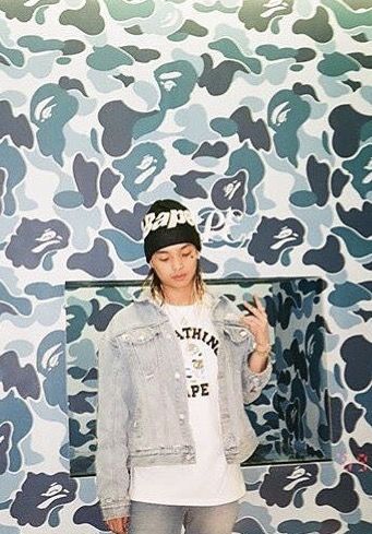 Keith Ape wearing Bape t-shirt and a Bape beanie