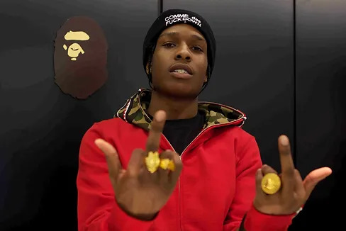 A$AP Rocky wearing red Bape camo hoodie