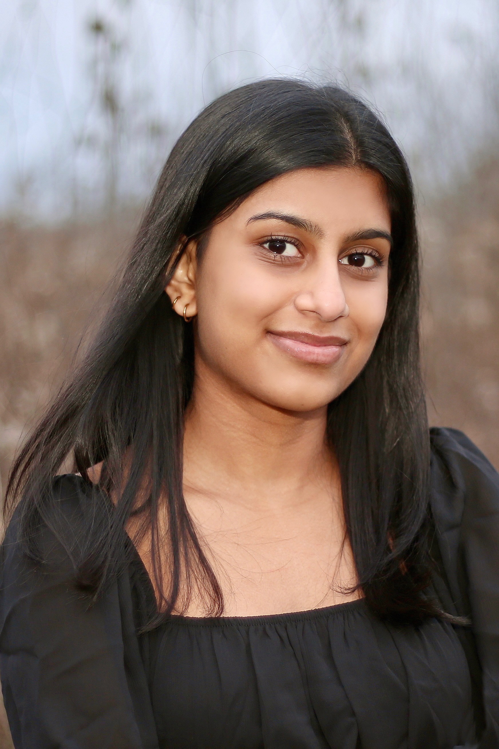 girl standing with arms crossed