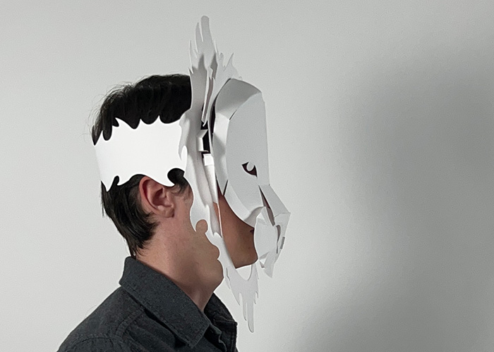 A bristol paper lion mask from the side.