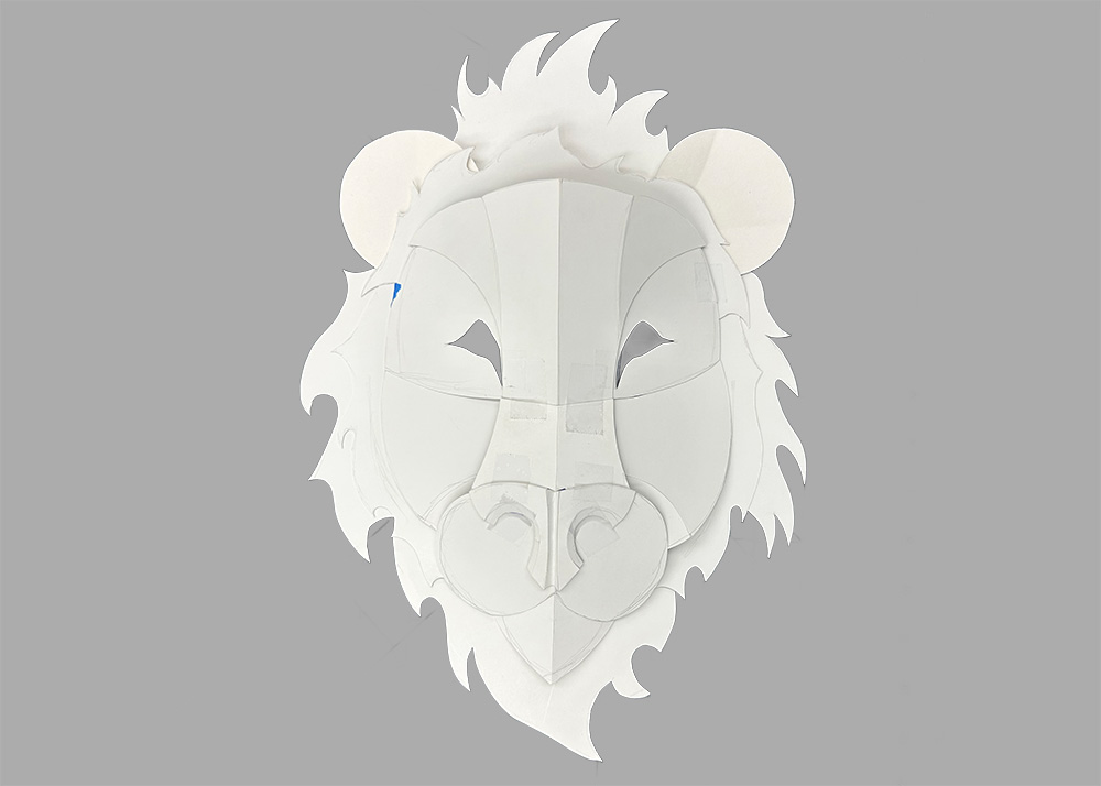 An early prototype of the lion mask. It is much more two-dimensional than the final.