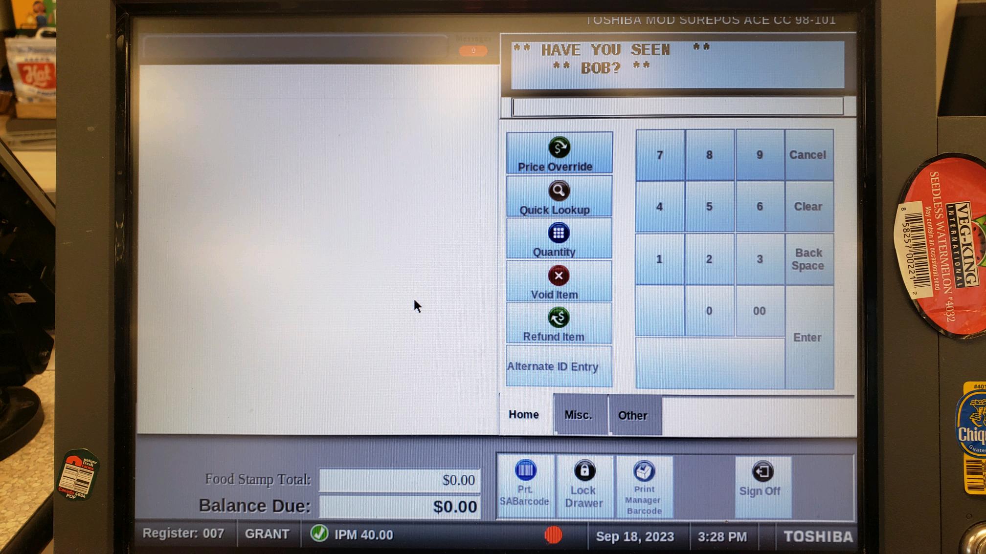 Image of the main register display with stickers all over the edges. Note: produce stickers aren't actually allowed, but we use them anyway