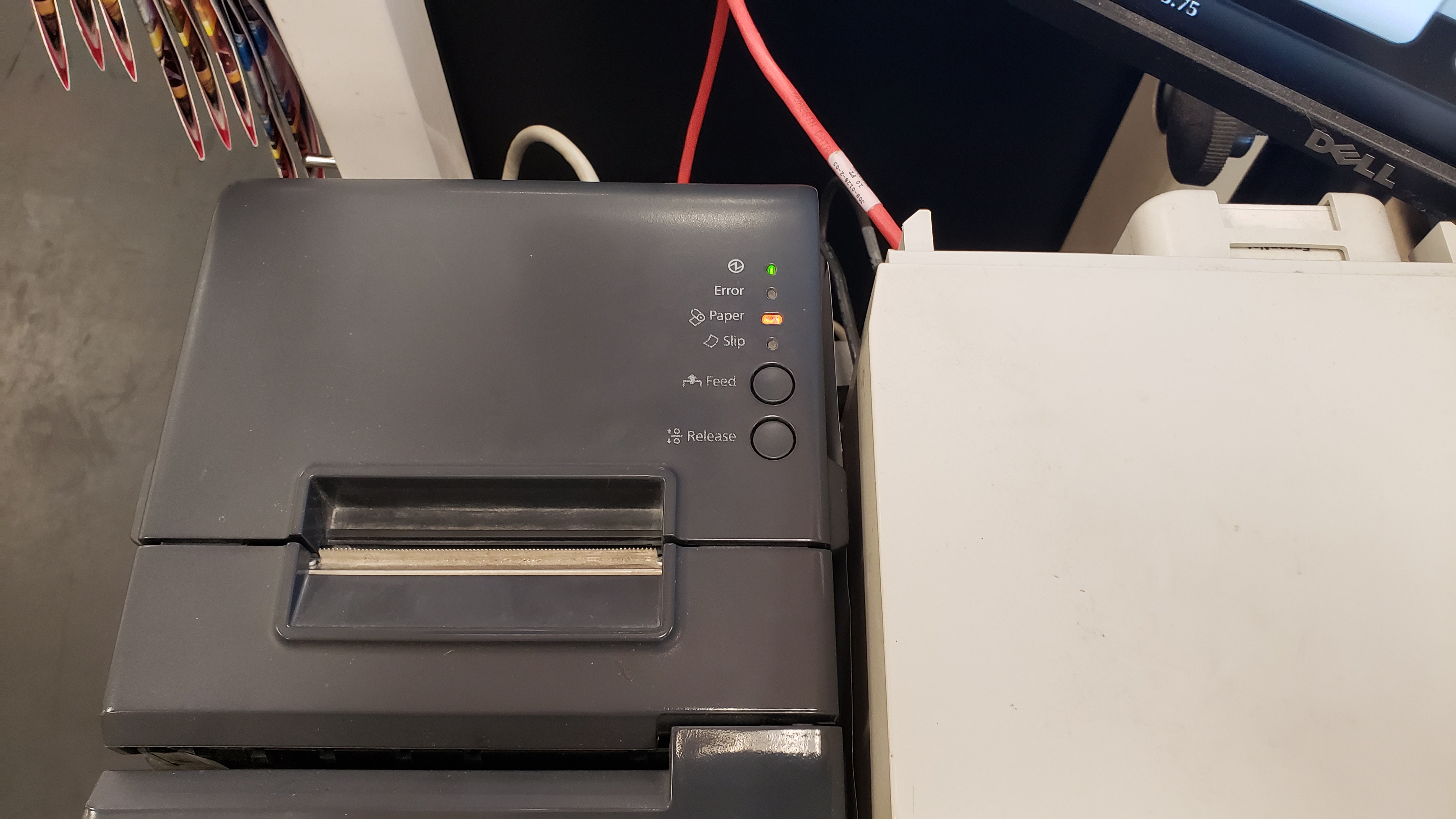 Image of the register's receipt printer that jams more than an old woman with a hand-picked strawberry obsession and a world supply of pectin.